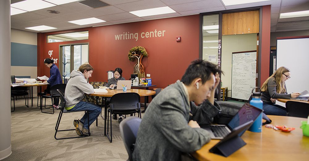 Students focusing on their writing at Earlham's Writing Center