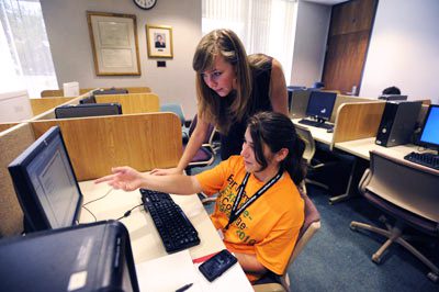 Two students working on a computer project