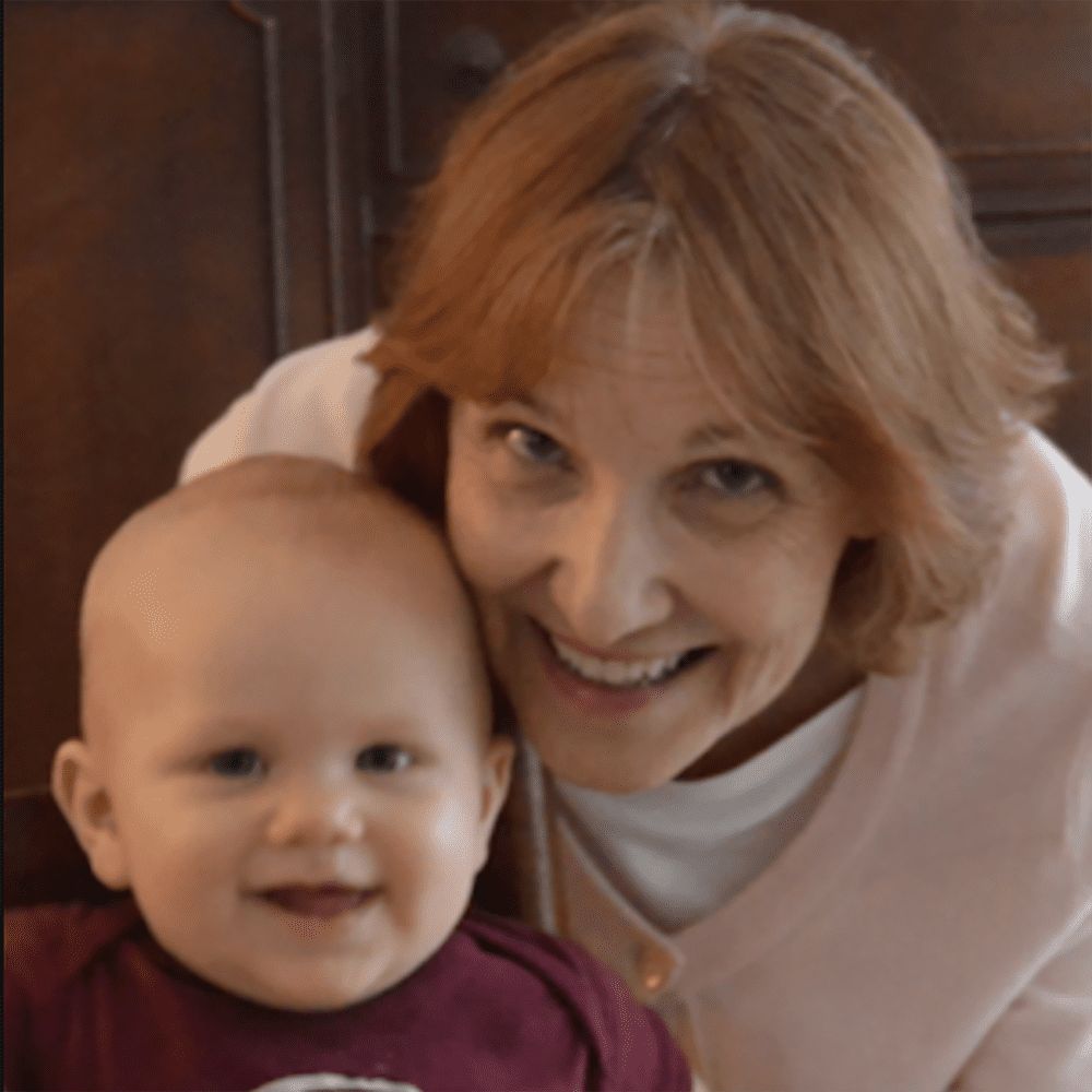 Betsy Metzgar with baby smiling photo