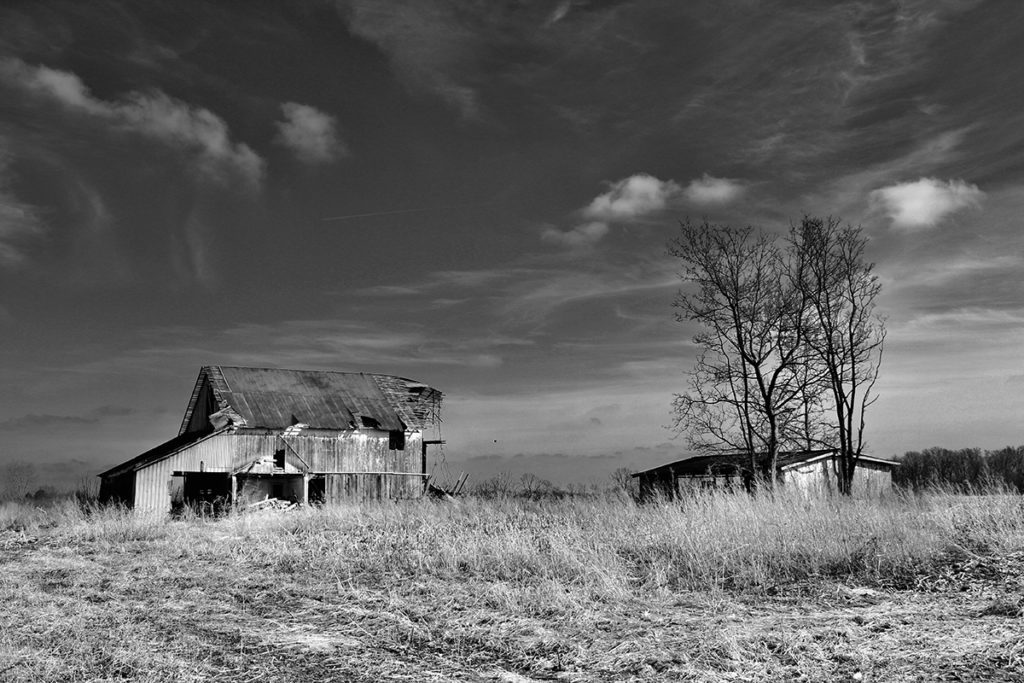 black & white prairie with old barn