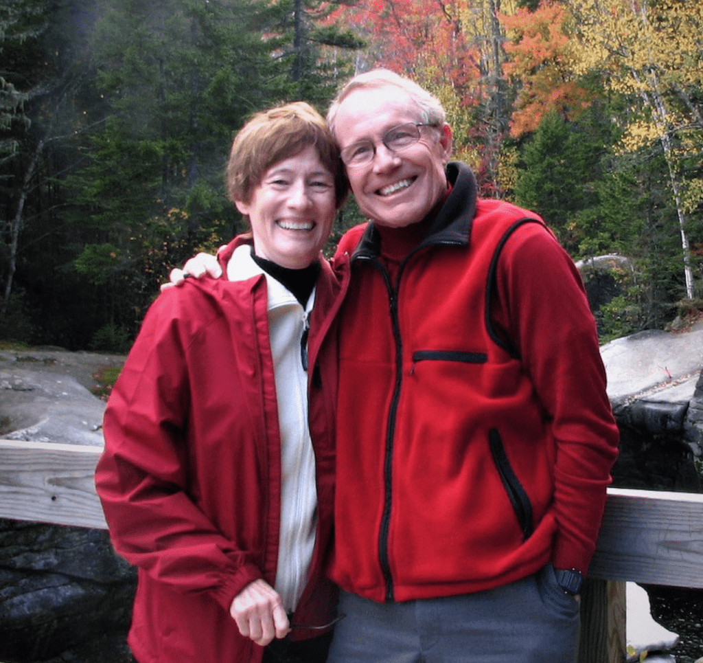Jerry and Jannie with trees in the fall