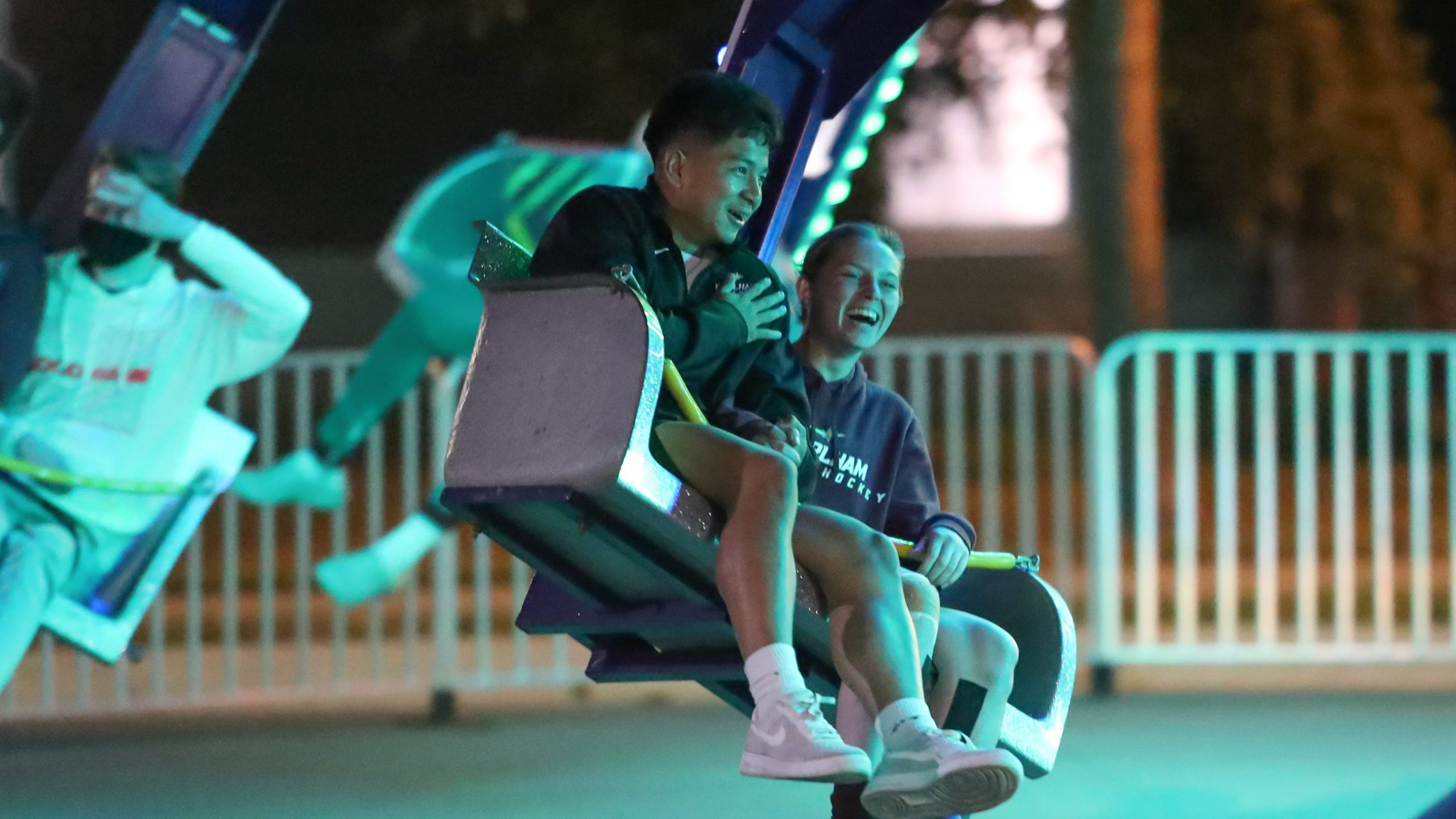 Students enjoy themselves on carnival ride at Earlham.
