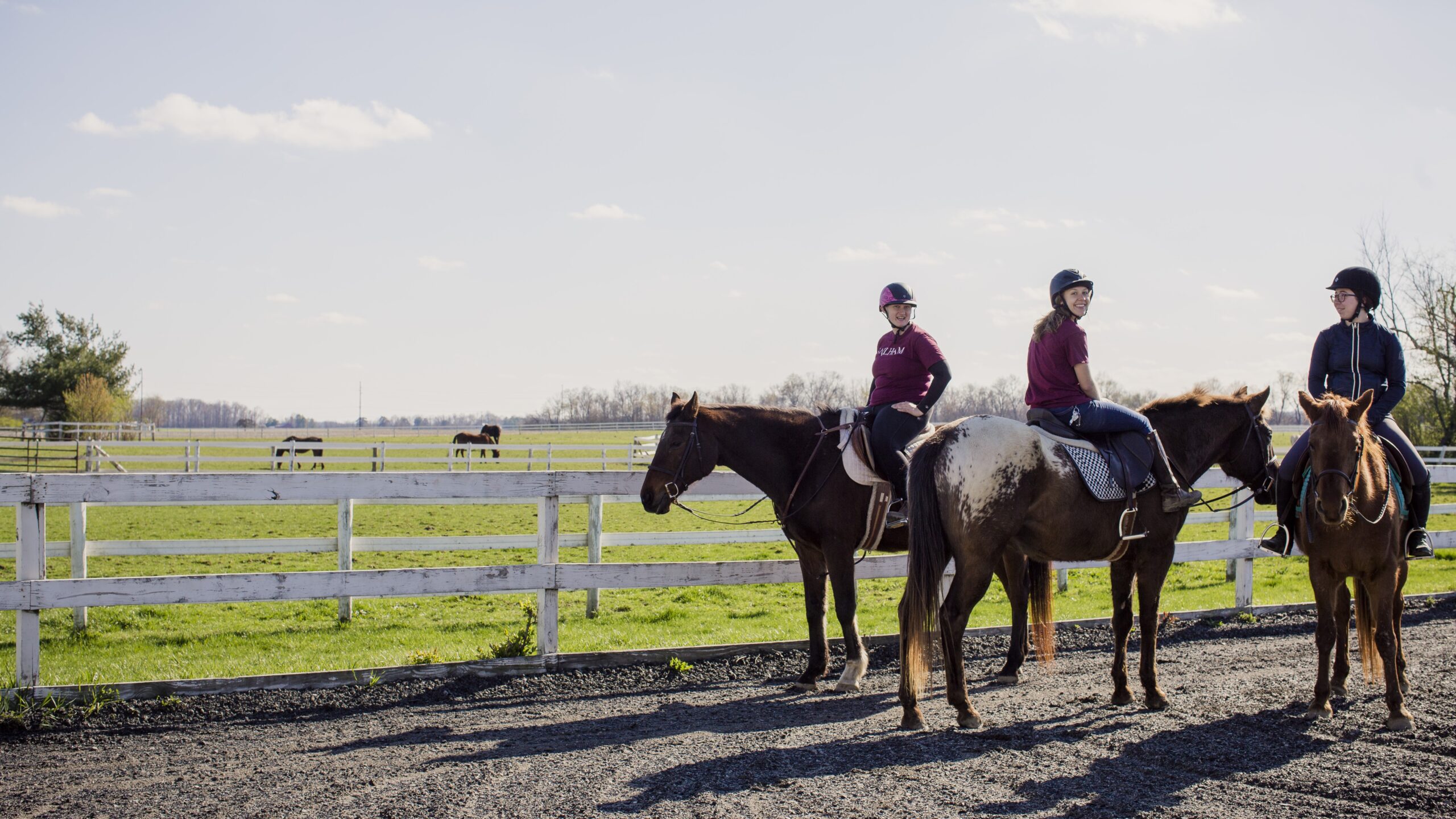Members of the equestrian program enjoying a beautiful spring day on horses.