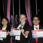 Students Linh Nguyen (left), Jasmyn Meeker (center), and Ashutosh Mishra (right) pose with their earned medals.