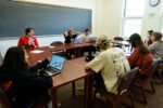 Professor Joanna "Jo" Swanger laughs while leading a classroom of peace and global studies seniors in spring 2024.