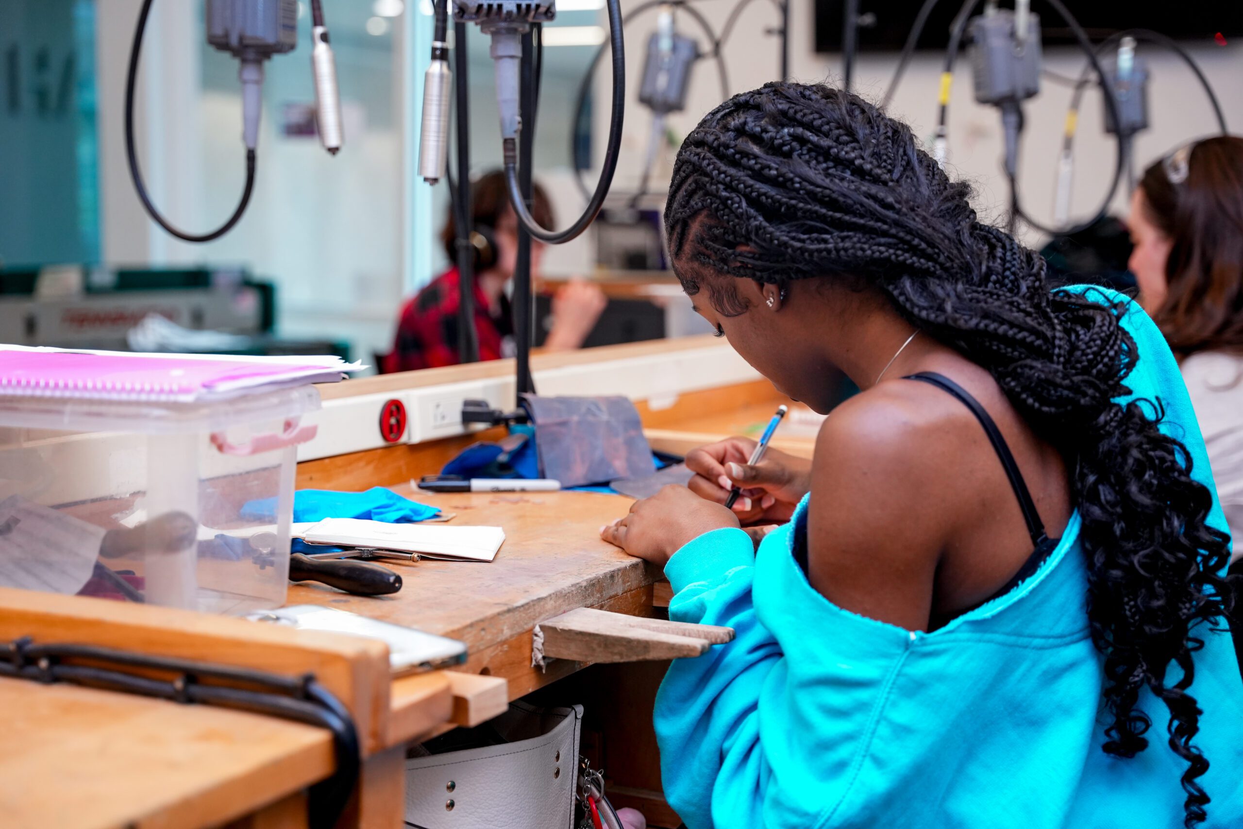 student practicing metalsmithing at Earlham Summer