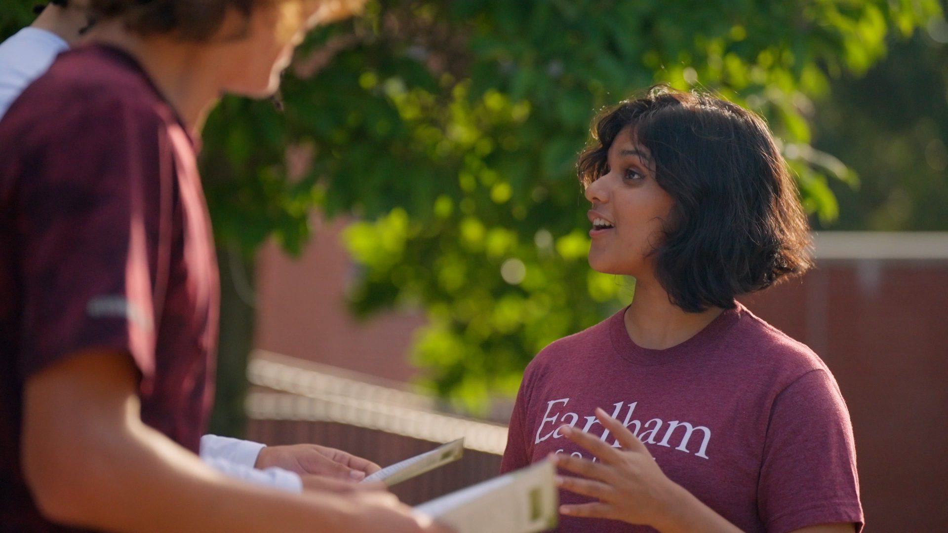 An International Student talking with other students