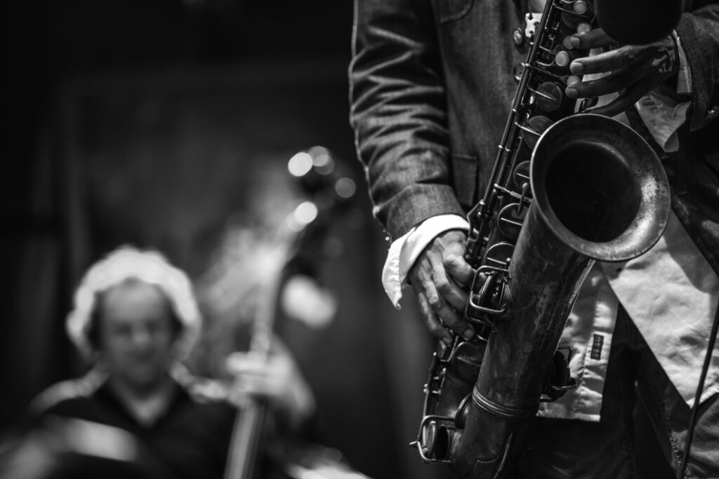 Close-up of a saxophone being played by a musician.