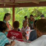 Heather Lerner stands in the middle of a community gathering