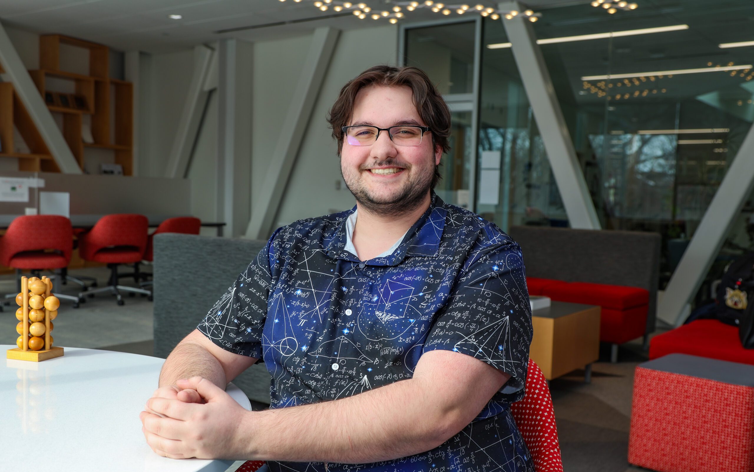 Dera Driscoll sitting at a table in a study room
