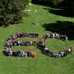 An aerial view of students from the Class of 2030 lined up in the shape of a giant E and C.